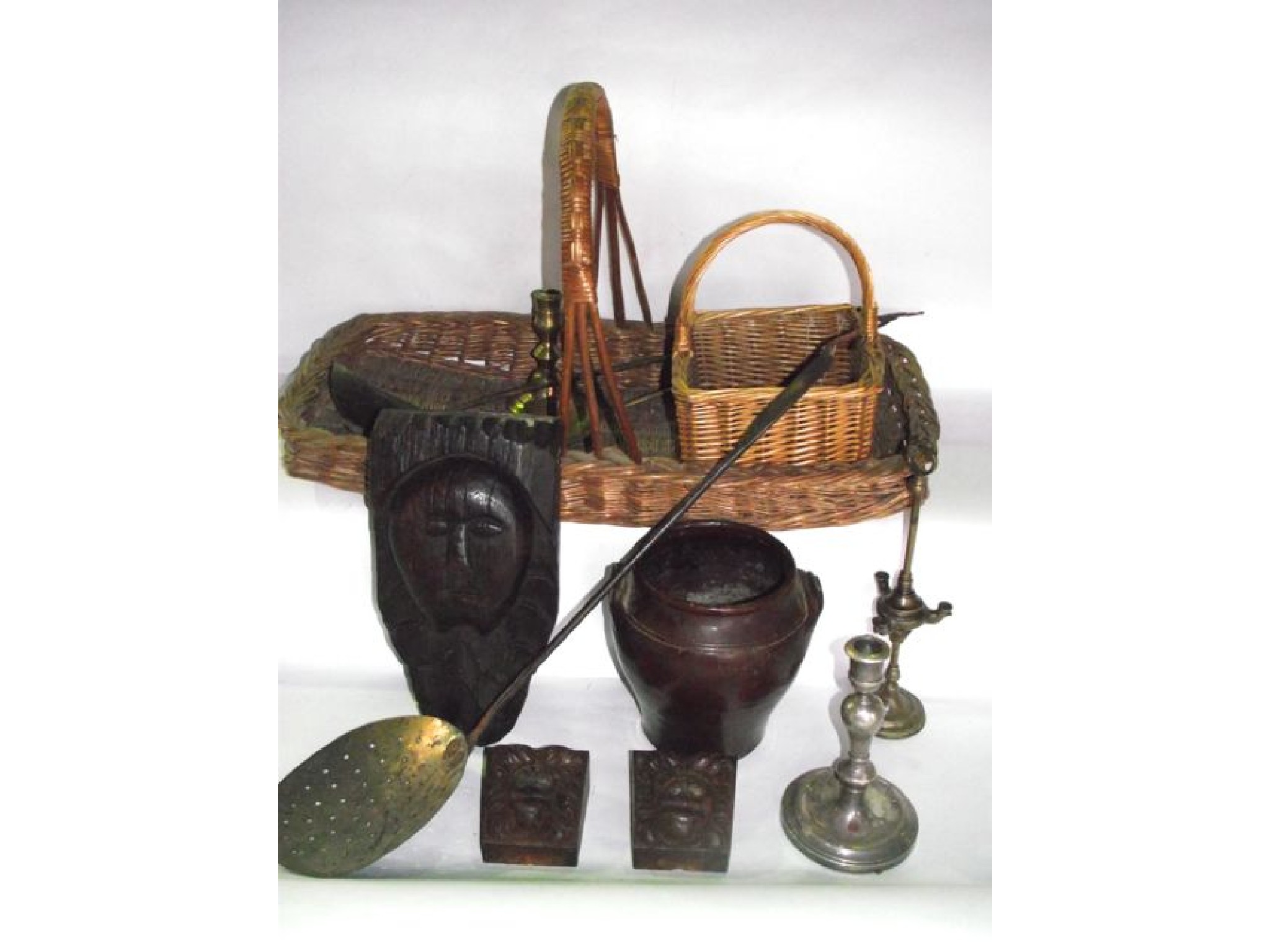 Appraisal: A wicker basket of rectangular form containing an antique iron