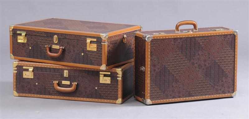 Appraisal: THREE PIECES OF ESCADA BRASS AND LEATHER MOUNTED SUITCASES to