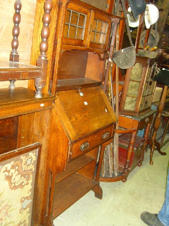 Appraisal: An Arts Crafts style oak bureau bookcase as one the