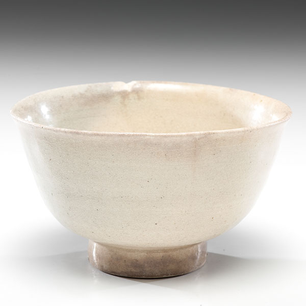 Appraisal: Chinese Tang dynasty A footed bowl covered in a pale