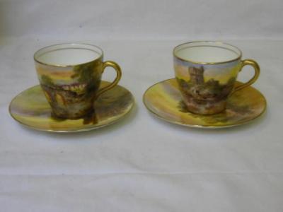 Appraisal: A PAIR OF ROYAL DOULTON PORCELAIN MINIATURE CUPS painted by