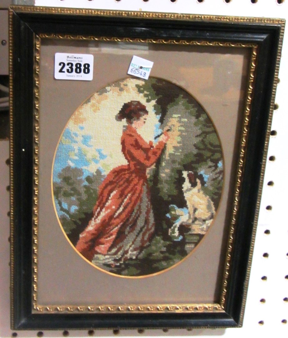 Appraisal: A needlework picture of a lady and spaniel mid th