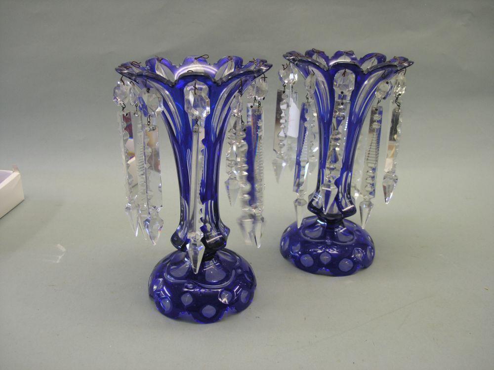 Appraisal: A pair of Victorian blue overlaid glass table lustres with