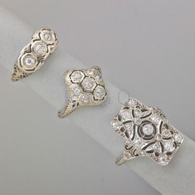 Appraisal: THREE ART DECO DIAMOND FILIGREE RINGS Platinum pierced rectangular panel