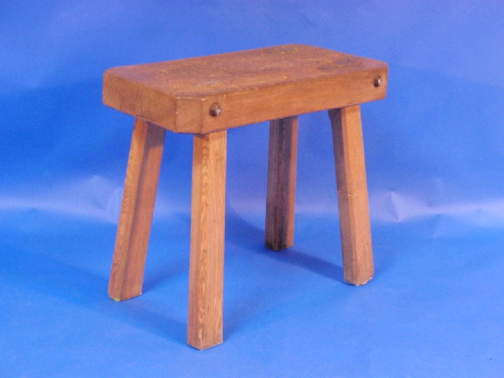 Appraisal: A butchers block table raised on four legs cm x