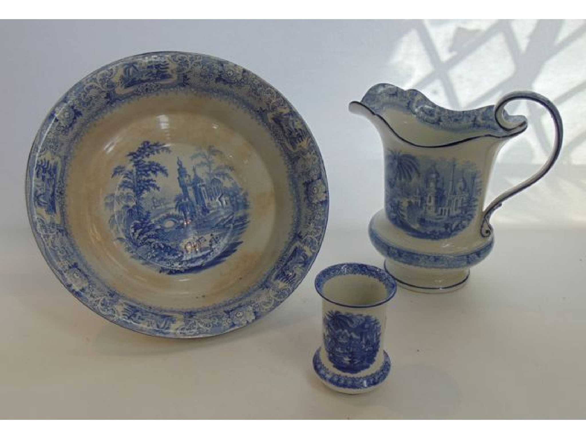 Appraisal: A th century blue and white jug and basin with