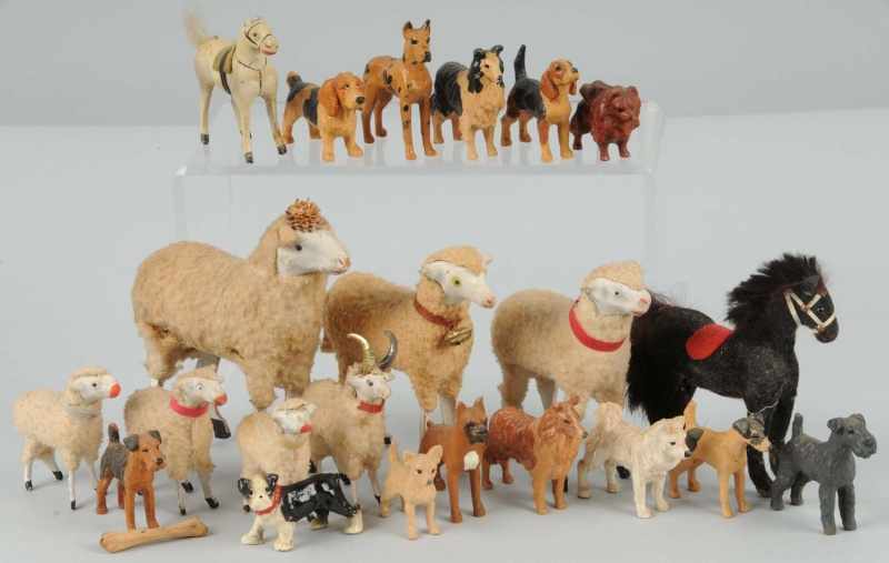 Appraisal: Lot of Wooden Composition Animals Description Includes seven sheep one