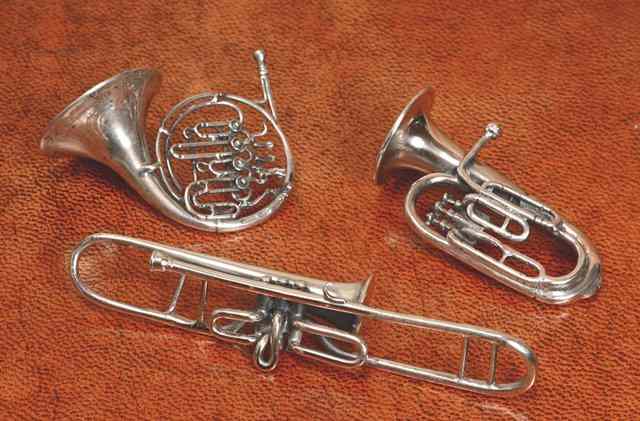 Appraisal: A CONTINENTAL MINIATURE TROMBONE long stamped a tuba and a