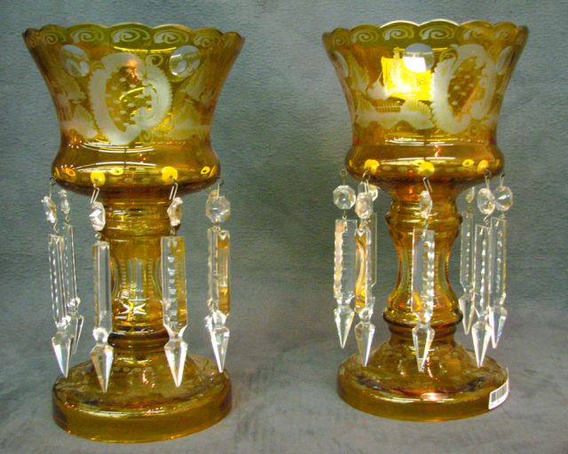 Appraisal: Pair of amber bohemian glass lustres with prisms etched to