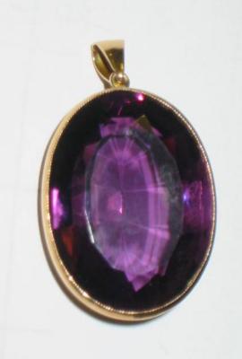 Appraisal: A LARGE AMETHYST PENDANT the oval cut amethyst held in