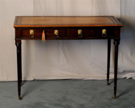 Appraisal: An English Leather Top Writing Table having an apron with