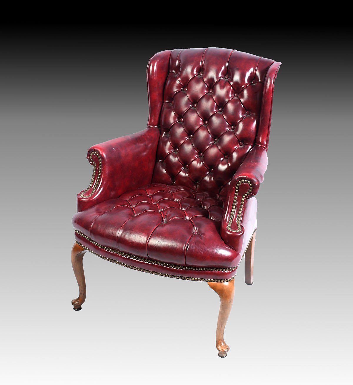 Appraisal: RED LEATHER CHESTERFIELD CHAIR Oxblood red leather wing back chair