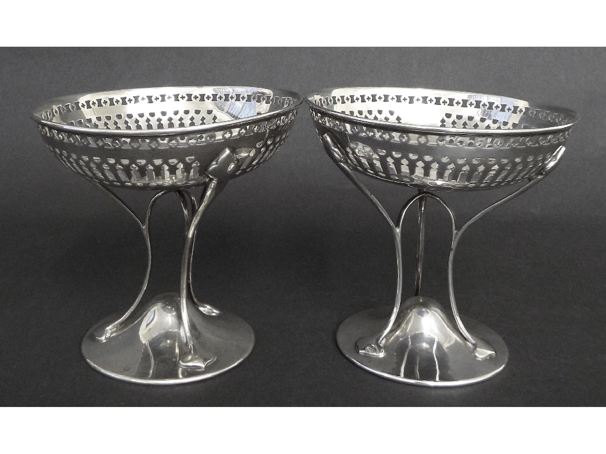 Appraisal: Attractive pair of Arts Crafts silver pedestal bonbon dishes with