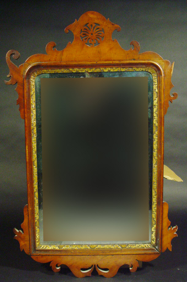 Appraisal: Victorian walnut framed rectangular bevel edged mirror with pierced pelmet