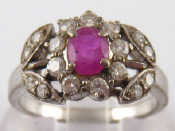 Appraisal: A white metal tests carat gold ruby and diamond ring