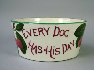 Appraisal: A Wemyss dog bowl painted Every Dog Has His Day