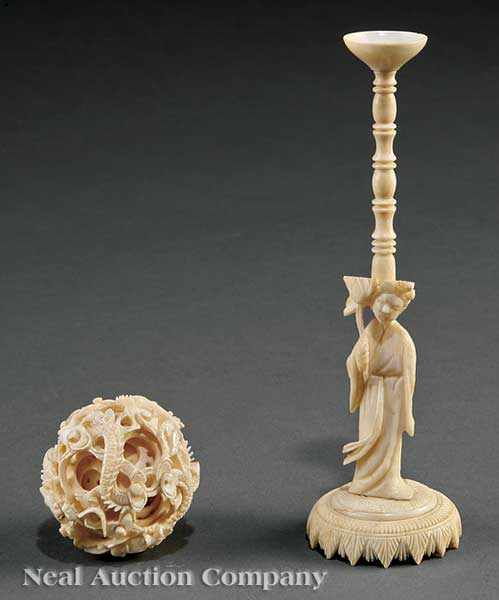 Appraisal: A Chinese Ivory Puzzle Ball on Figural Stand the ball's