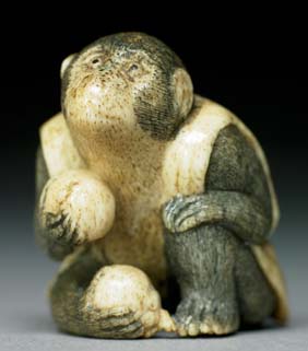 Appraisal: ANTIQUE STAGHORN NETSUKE Antique carved staghorn netsuke of a monkey