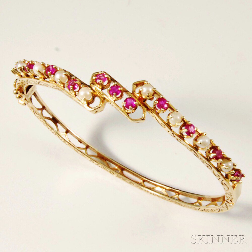 Appraisal: kt Gold Ruby and Pearl Bangle the band with openwork