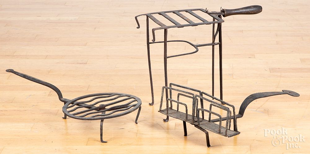 Appraisal: Wrought iron toaster trivet and revolving trivet Wrought iron toaster