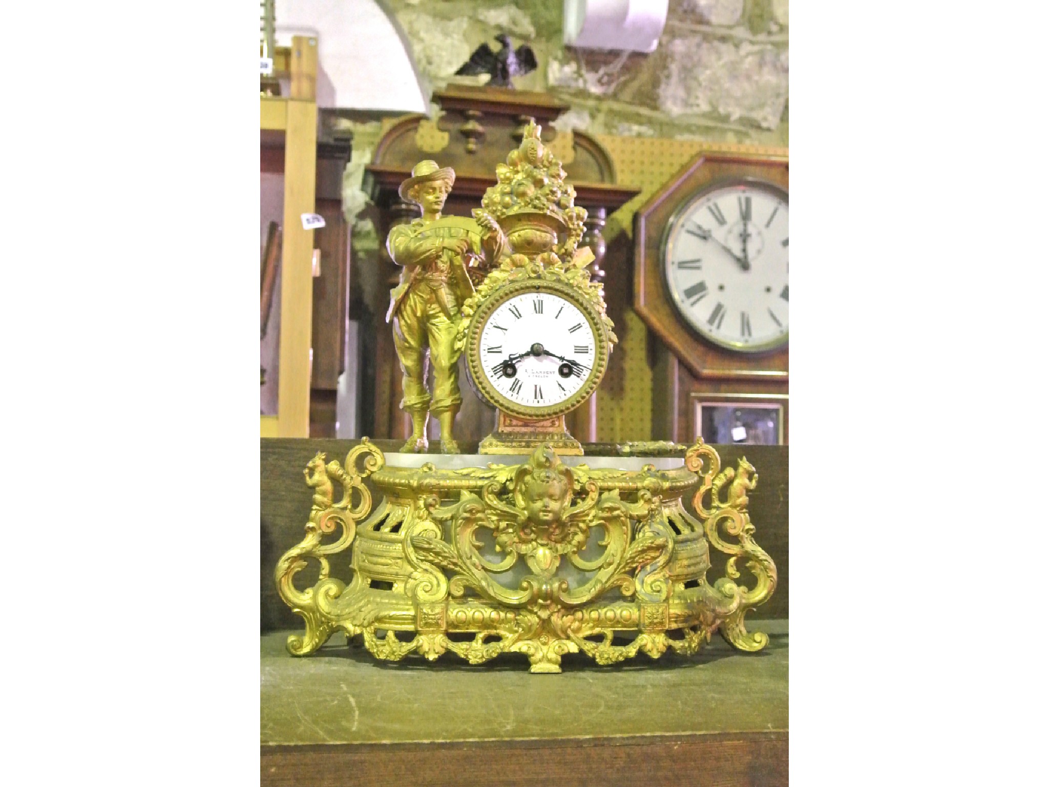 Appraisal: A mid th century gilded brass mantle clock the drum