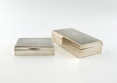 Appraisal: Two modern silver cigarette boxes the larger marks worn the