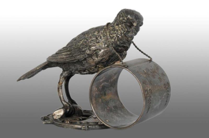 Appraisal: Large Bird on Perch Figural Napkin Ring Description Marked Meriden