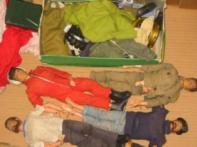 Appraisal: Four various Action Man dolls and a quantity of clothing