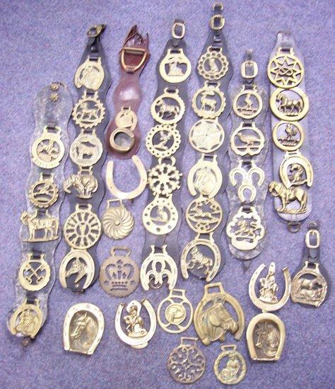 Appraisal: Six various harness straps with a collection of horse brasses