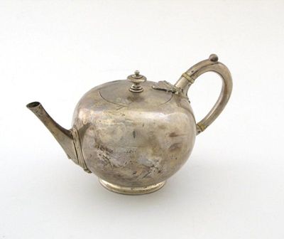 Appraisal: A Victorian bullet teapot on a spreading circular foot knop