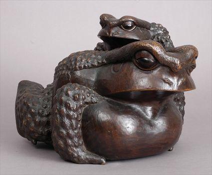 Appraisal: JAPANESE CARVED WOOD FROG GROUP Carved as a mother frog