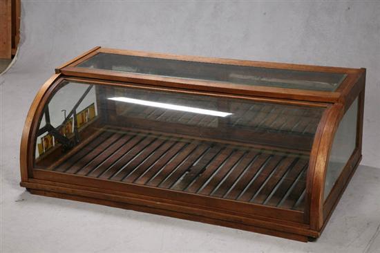 Appraisal: COUNTER TOP DISPLAY CASE Oak frame with curved glass front