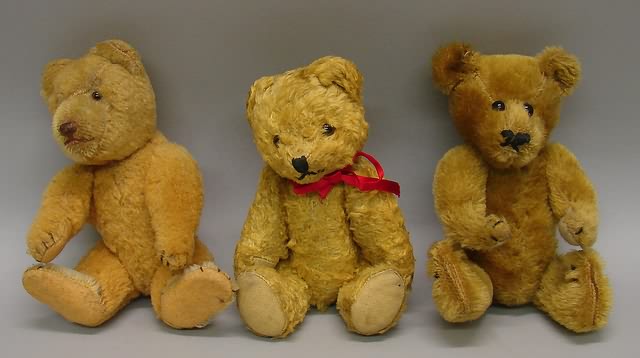 Appraisal: Lot of little bears Gold rayon plush has clear glass