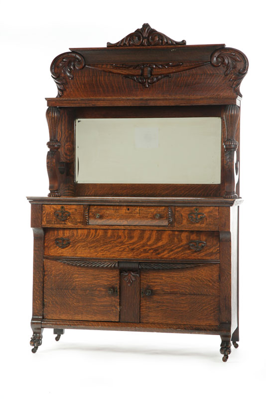 Appraisal: SIDEBOARD WITH MIRRORED BACK Oak having an acanthus carved crest