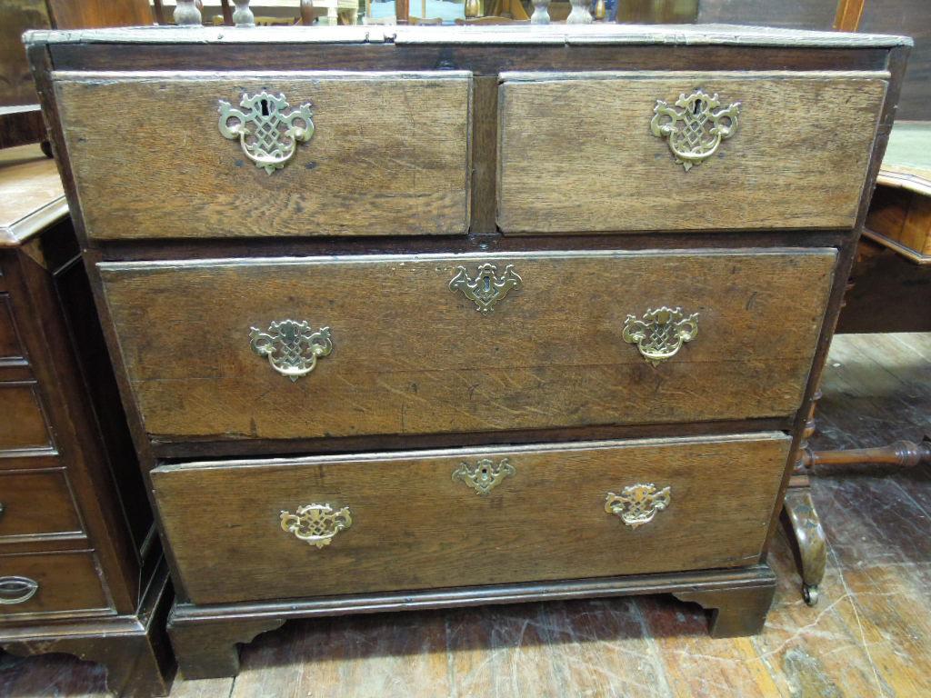 Appraisal: A Georgian oak chest fitted with two long and two