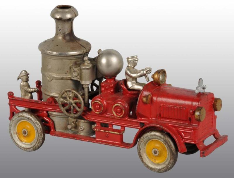 Appraisal: Cast Iron Fire Pumper Toy Description American Metal disc wheels