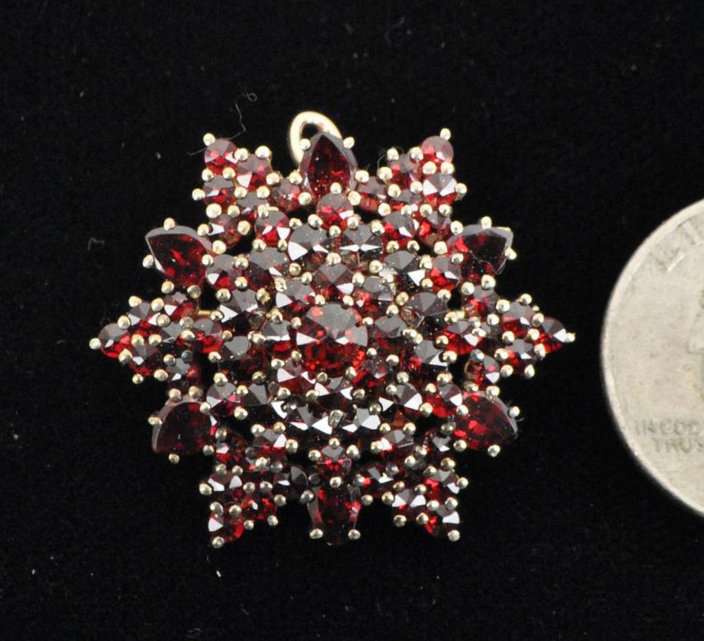 Appraisal: Gold Garnet Starburst Form Pin also fitted with hinged bail