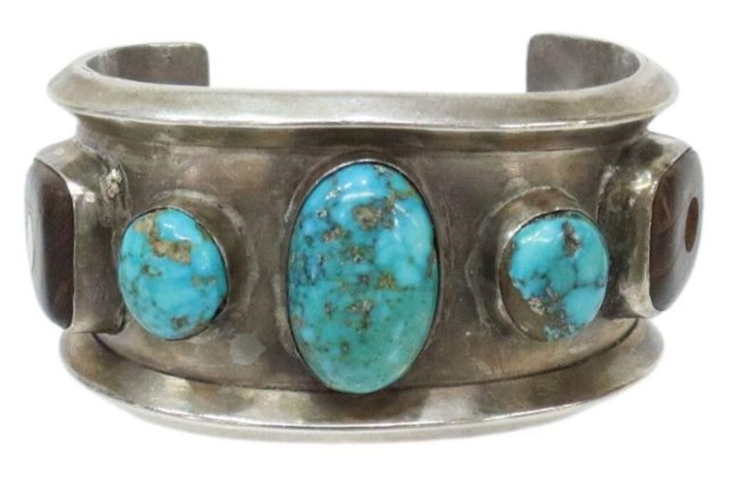 Appraisal: Native American silver content unknown cuff bracelet three bezel-set turquoise