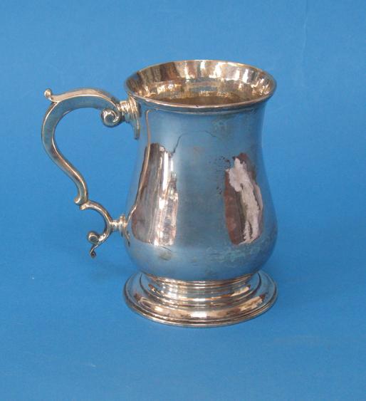 Appraisal: A GEORGE III MUG of baluster form with a scroll