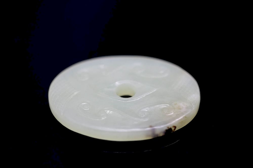 Appraisal: WHITE JADE BI DISC of oval form the color of