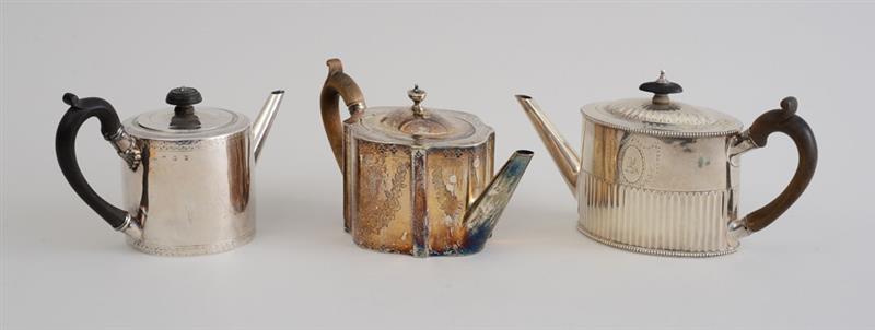 Appraisal: THREE GEORGE III SILVER TEAPOTS Comprising one of cylindrical form