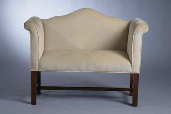 Appraisal: CHIPPENDALE STYLE MAHOGANY UPHOLSTERED HALL BENCH Shaped domed back high