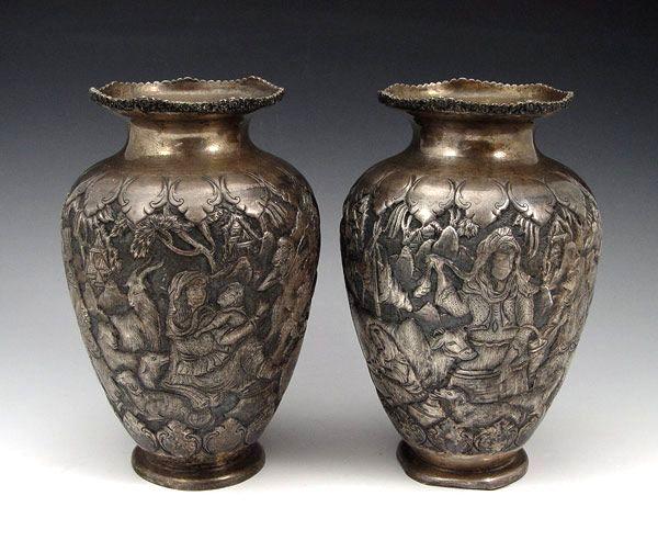 Appraisal: PAIR PERSIAN SILVERED METAL VASES Silvered repousse metal vases with