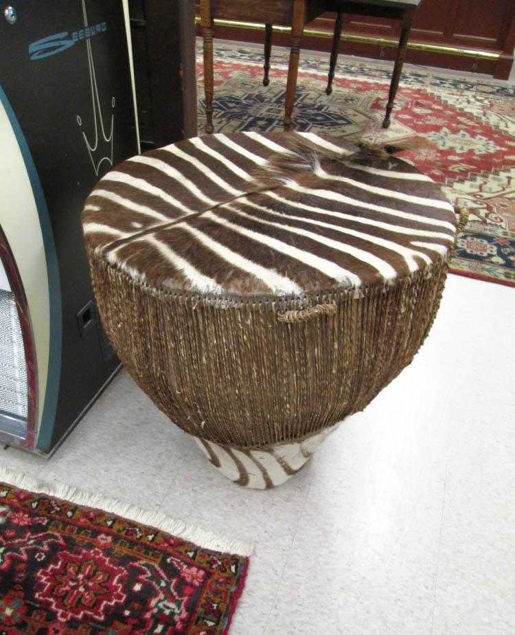 Appraisal: AN AFRICAN ZEBRA SKIN DRUM H x D