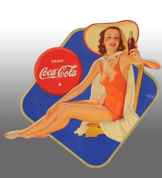 Appraisal: Cardboard Coca-Cola Die-Cut Bathing Girl Description Includes original string hanger