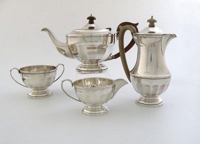 Appraisal: A matched four-piece silver tea set of circular panelled form