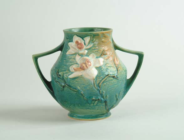 Appraisal: ROSEVILLE MAGNOLIA HANDLED VASE Shape No Roseville mark in relief