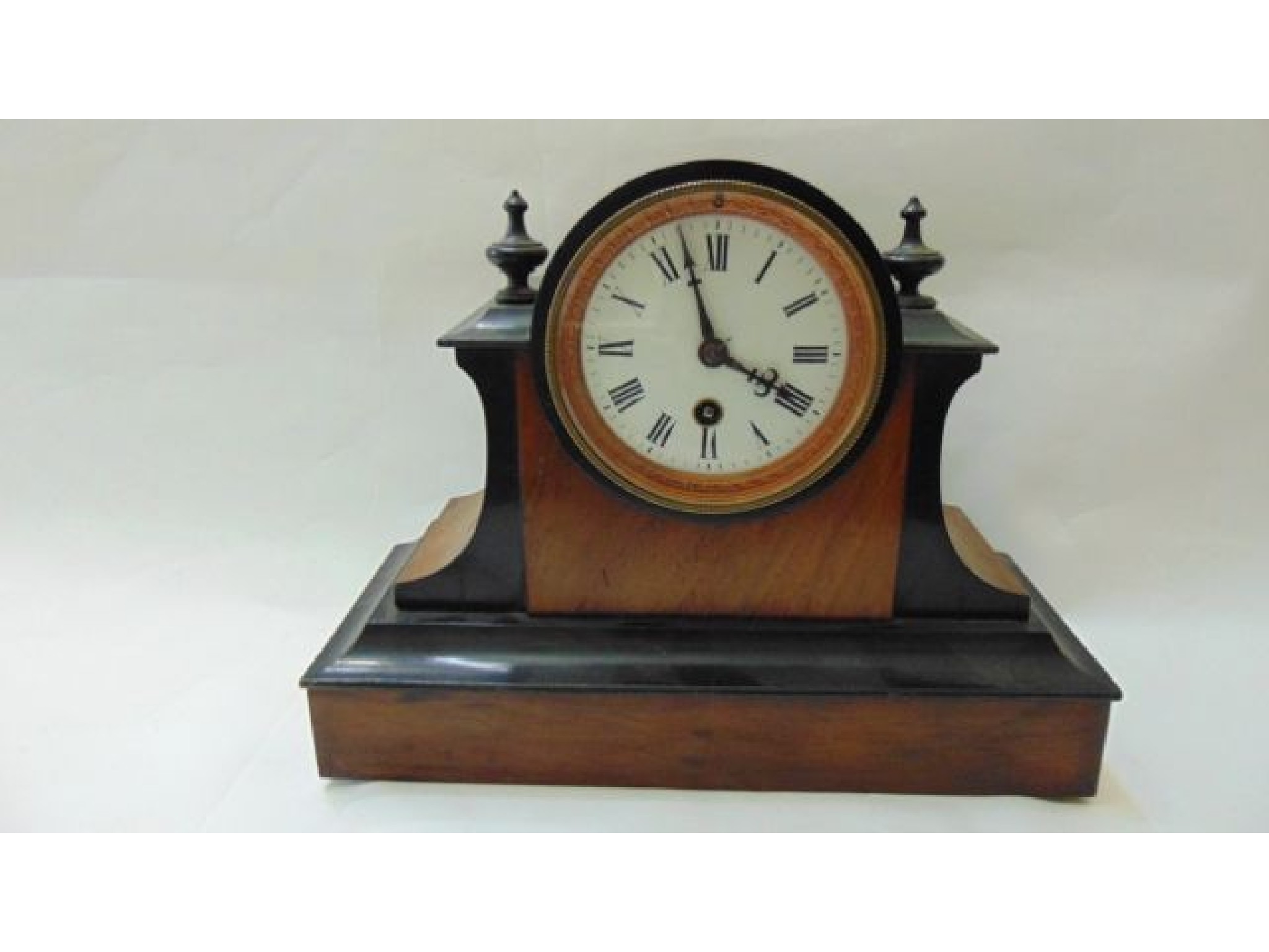 Appraisal: A late th century walnut and ebonised mantle clock with