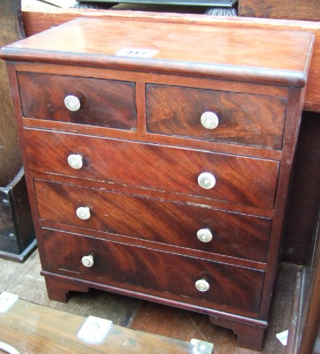 Appraisal: A miniature Victorian mahogany chest of two short over three