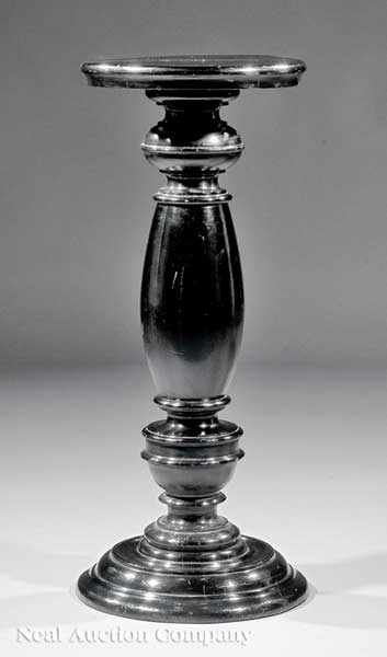 Appraisal: An Ebonized Pedestal th c turned vasiform body height in